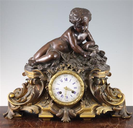 A 19th century French bronze and ormolu mantel clock, 15in.